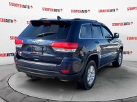 This outstanding example of a 2015 Jeep Grand Cherokee Laredo is offered by Stampede Auto. The Jeep... (image 4)