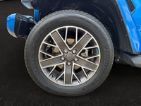 The 2023 Jeep Wrangler High Altitude 4xe combines iconic open-air off-road freedom with executive-le... (image 8)