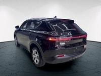 Introducing the 2024 Dodge Hornet GT AWD, a dynamic SUV that commands attention with its black-on-bl... (image 8)
