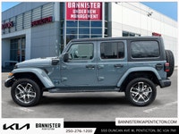 Step into adventure with the 2024 Jeep Wrangler 4xe Sport S, a versatile SUV in a stunning silver fi... (image 4)