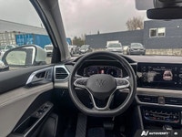 This 2025 Volkswagen Taos Comfortline, with a mere 12,750 kilometers, offers a harmonious blend of r... (image 8)
