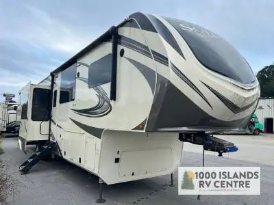 Grand Design Solitude fifth wheel 390RK highlights: Five Slides Raised Rear Kitchen Dual-Sink Vanity...