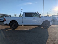 The 2026 Ram 2500 Laramie Crew Cab Night Edition in Bright White combines aggressive style, heavy-du... (image 7)