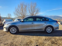Experience the sophisticated charm of the 2024 Kia Forte LX IVT, presented in a sleek Gray finish wi... (image 3)