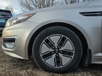 Experience the elegant blend of style and efficiency with the 2012 Kia Optima Hybrid, finished in a... (image 4)