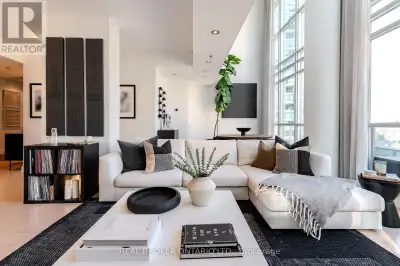 Rising above the city in Boutique Condos at 21 Nelson, this striking lower penthouse offers a rare s...