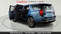 The 2025 GMC Yukon Elevation combines bold styling, spacious versatility and powerful performance in... (image 9)