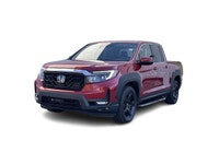 Our 2023 Honda Ridgeline Touring in Radiant Red Metallic is a local lease return! This vehicle is in... (image 1)