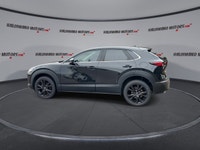 // ACCIDENT FREE!! // Finished in Black with a Burgundy interior, this used 2022 Mazda CX-30 GT w/Tu... (image 4)
