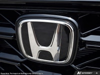 The 2026 Honda CR-V Hybrid EX-L AWD, dressed in a sophisticated white exterior and outfitted with a... (image 8)