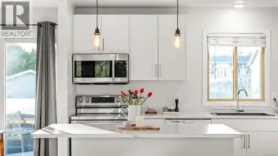 A COMOX MUST-SEE: This fully renovated home with a self-contained suite in the heart of Comox, offer...