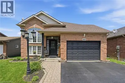 Welcome to 4869 Cherrywood Drive, Beamsville — a beautifully maintained raised bungalow tucked away...