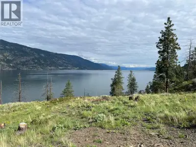 Exceptional Waterfront building site offering 2.5 acres to build your dream home; in the exclusive g...