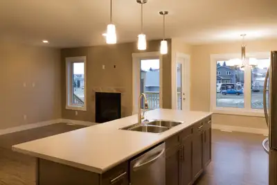 This beautiful new duplex features 3 bedrooms and 2.5 bathrooms. The main floor offers an open conce...