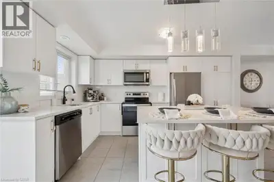 Welcome to 271 Law Dr, a beautifully renovated 3-bedroom, 2.5-bathroom townhome backing directly ont...