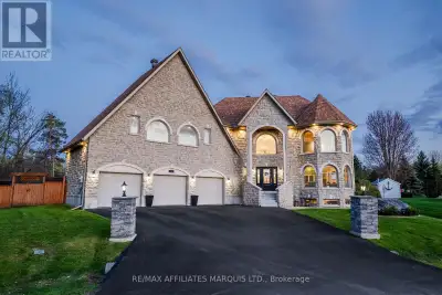 A stunning indoor heated salt water pool with hot tub and sauna, unbelievable curb appeal, a three c...