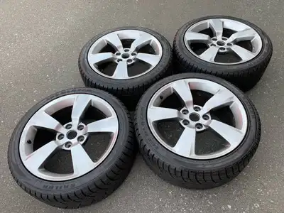 Here is a set of Genuine OEM Subaru WRX STI 18" rims in good used condition mounted with sailun Ice...