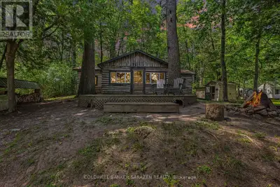 This quiet retreat is cute as a button! A rare opportunity to own just under 200 feet of waterfront...
