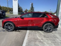 The 2026 Cadillac LYRIQ Signature Sport, finished in Radiant Red Tintcoat with a refined Oxford Ston... (image 4)