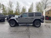 This 2022 Jeep Wrangler 4xe Unlimited Rubicon, in an attention-grabbing Sting-Grey, represents the p... (image 3)