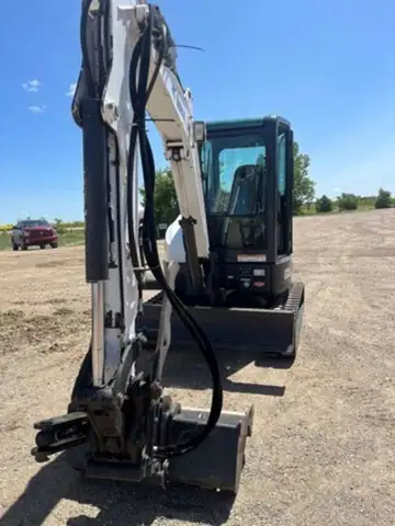 Cab w/ AC, Long Arm, Rubber Tracks, 12in. Bucket, 24in. Bucket, Aux Hydraulics, BladeA71 Package, Co...