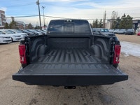 The 2026 Ram 2500 Laramie Mega Cab in Diamond Black Crystal Pearl combines heavy-duty capability wit... (image 5)