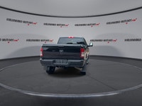 Meet the 2023 RAM 2500 Big Horn 4x4 Crew Cab 6'4 Box with the Night Edition package, offered by Hald... (image 6)