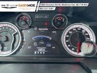 The 2022 Ram 1500 Classic SLT 4x4 Crew Cab stands out with its sophisticated gray exterior and power... (image 4)