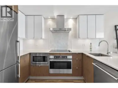 This impressively laid-out one-bedroom home with a versatile flex space, ideal as a den, offers both...