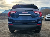 The 2022 GMC Terrain AWD SLE in a captivating Blue shade and equipped with an AWD drivetrain deliver... (image 5)