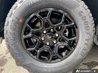 The 2026 Ford F-150 XLT, dressed in a striking Oxford White finish, showcases a commanding 4x4 drive... (image 6)