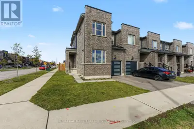 IMMACULATE END-UNIT TOWNHOME ON A CORNER LOT WITH A FENCED BACKYARD, EV CHARGER & JUST ABOUT EVERYTH...