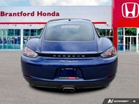 Feel the exhilaration of the open road with this stunning 2020 Porsche 718 Cayman in vibrant Gentian... (image 4)