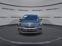 This used 2018 Honda Pilot Touring AWD is a roomy, family-ready SUV with smart features and proven V... (image 2)