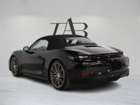 The 2018 Porsche 718 Boxster GTS embodies the essence of open-air performance with its mid-mounted 4... (image 4)