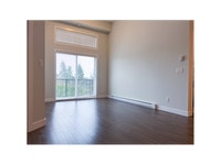 Each suite includes a stainless-steel fridge, stove, dishwasher, and microwave by Whirlpool, as well... (image 7)