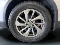 Meet the 2015 Nissan Rogue SL, a silver AWD SUV that perfectly combines robust handling with everyda... (image 6)