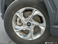 The expansive panoramic sunroof of this 2023 Hyundai Tucson Preferred offers breathtaking views, tra... (image 5)