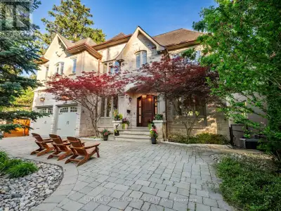 Set on a spectacular 63 x 187 ft ravine lot on one of North York's most sought-after streets, this l...