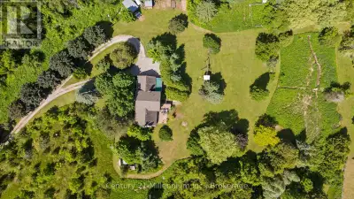 Escape the City and find peace with this charming family home on 25 acres! Functional main level inc...
