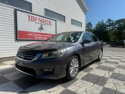 a refined midsize sedan. As an upper-tier trim, it features a leather-trimmed interior, heated front...