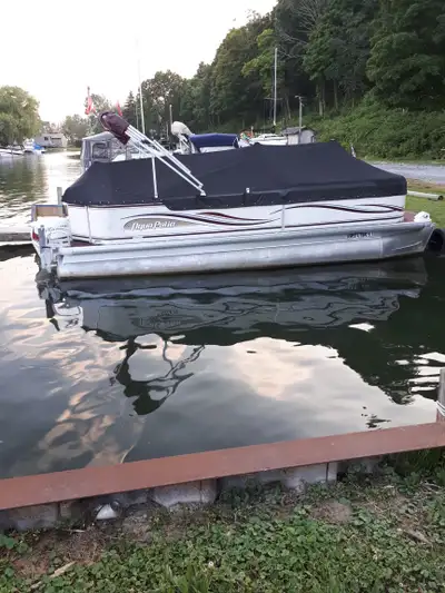 2003 Aqua Patio 220re. Reported with new Evinrude 115 p-etec in 2017 complete with control package....