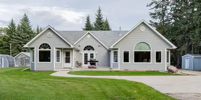 P03//Portage La Prairie/ACREAGE LIVING WITHIN CITY LIMITS! Escape to your own private, beautifully t...