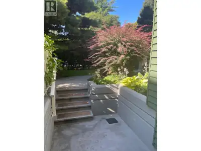 Spacious and bright garden-level home with open-concept living & dining area Recently renovated with...