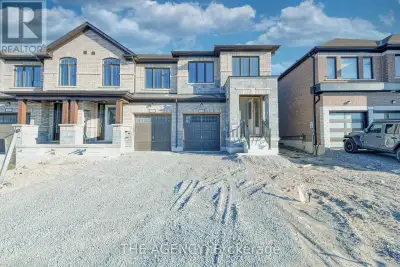 Welcome to 53 Butler Blvd a stunning end-unit townhome offering 2,010 sq. ft. of thoughtfully design...