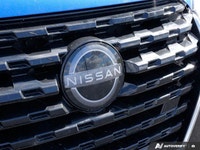 Navigate city streets with confidence and style in the 2022 Nissan Kicks S, striking in Electric Blu... (image 8)