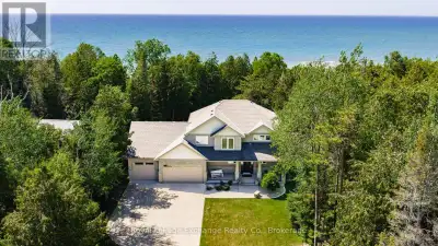 Tucked among mature cedars and offering 75 feet of pristine Lake Huron waterfront, this executive cu...
