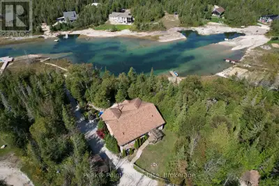 Looking for a Super Private, Turn-Key Lakefront Retreat with Sand Beach? This stunning 1900 square f...