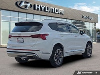 Wrapped in a stunning Quartz White, this 2022 Hyundai Santa Fe Ultimate Calligraphy offers a journey... (image 4)