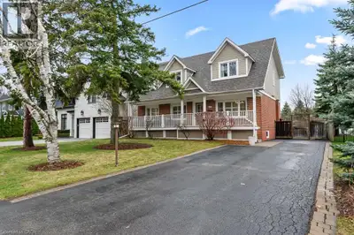 Charming Cape Cod style South East Oakville home nestled on a quiet street, featuring greenspace wit...